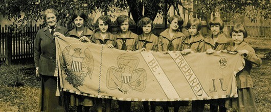 Juliette Gordon Low had a dream Juliette Gordon Low with girls holding banner