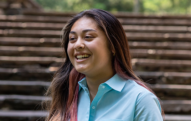 young girl outside smiling